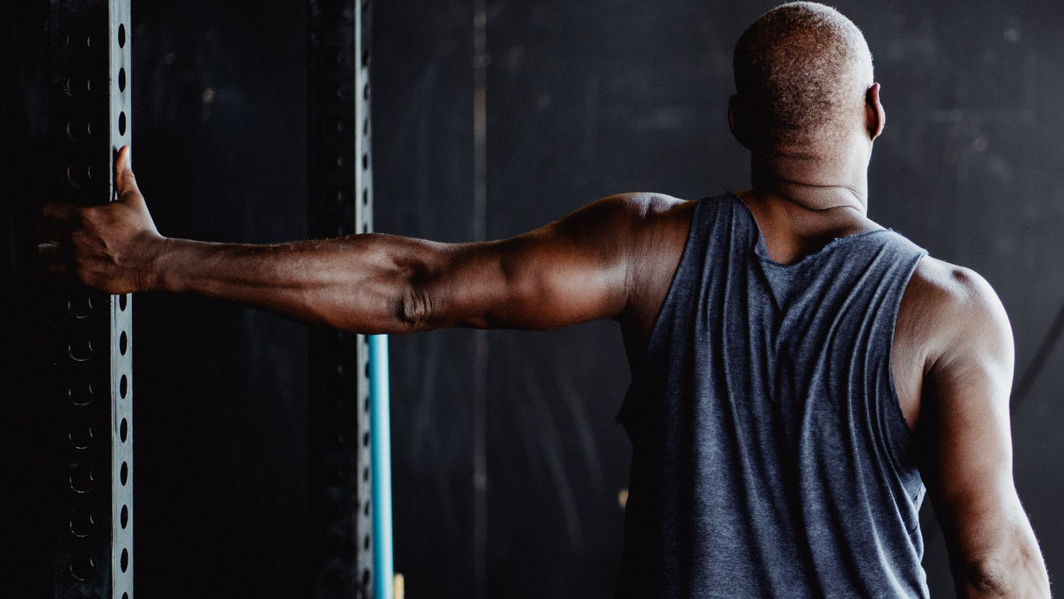 man stretching for muscle recovery