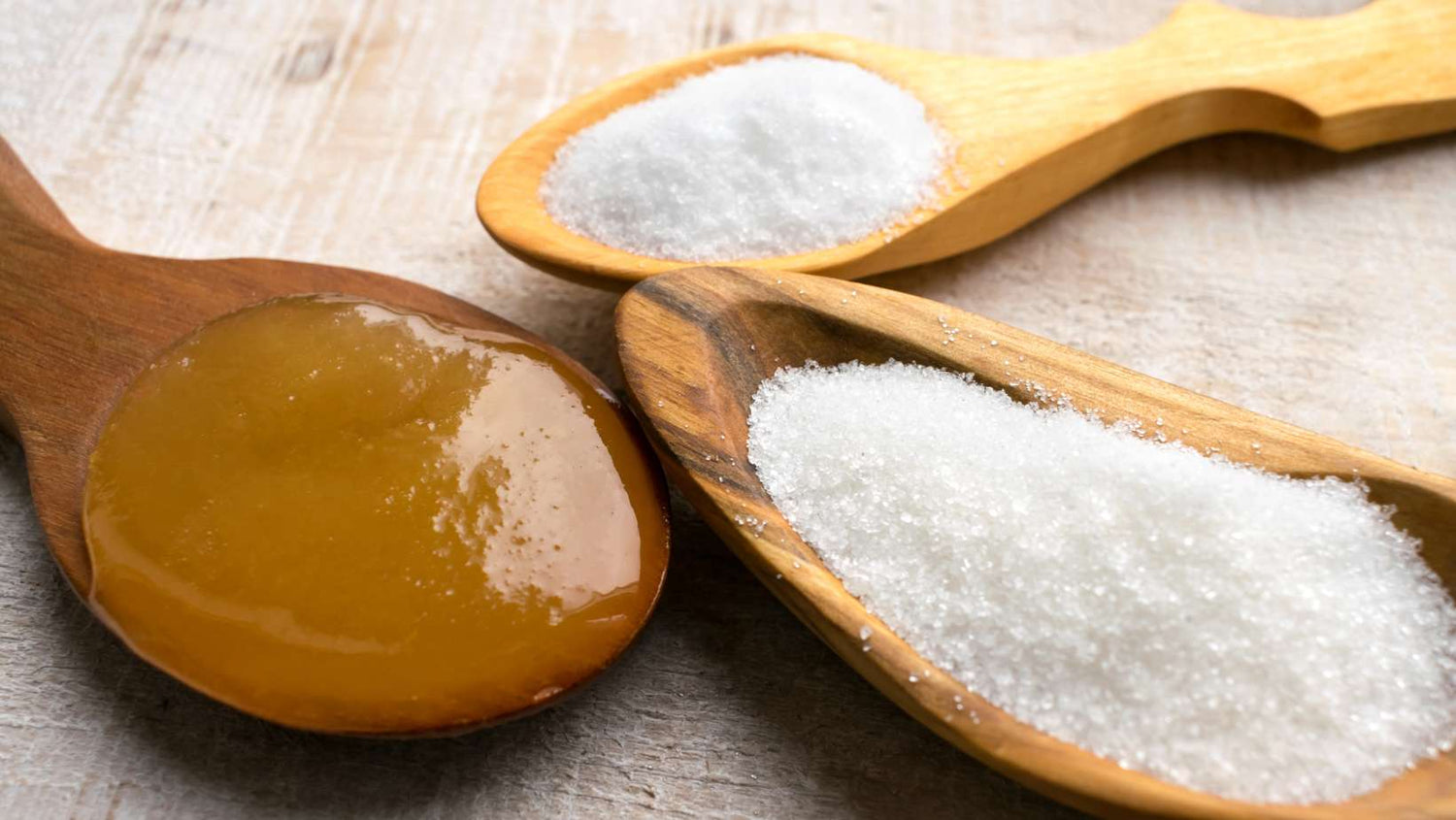 Artificial Sweeteners and Sugar Substitutes in wooden spoons. Natural and synthetic sugarfree food additive, sorbitol, fructose, honey, Sucralose, Aspartame