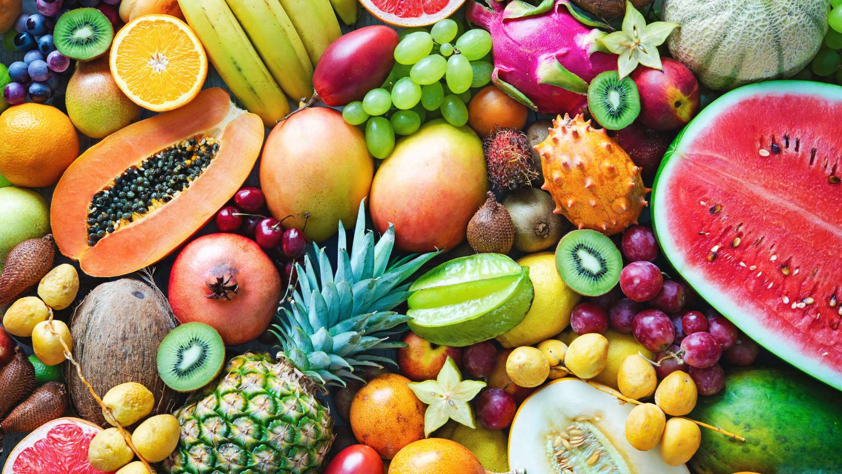 Assortment of colorful ripe tropical fruits. Top view