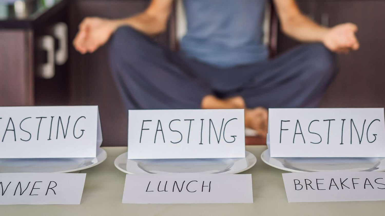 Fasting Every Meal Concept with Man Doing Yoga on Background