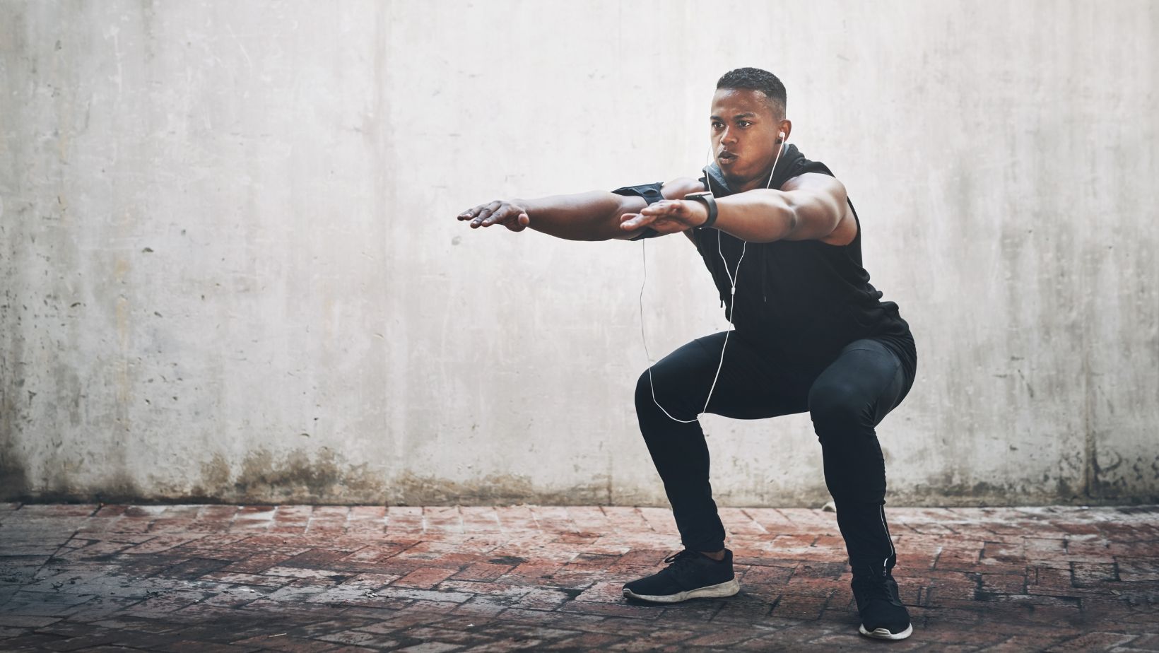 man doing squat pulses