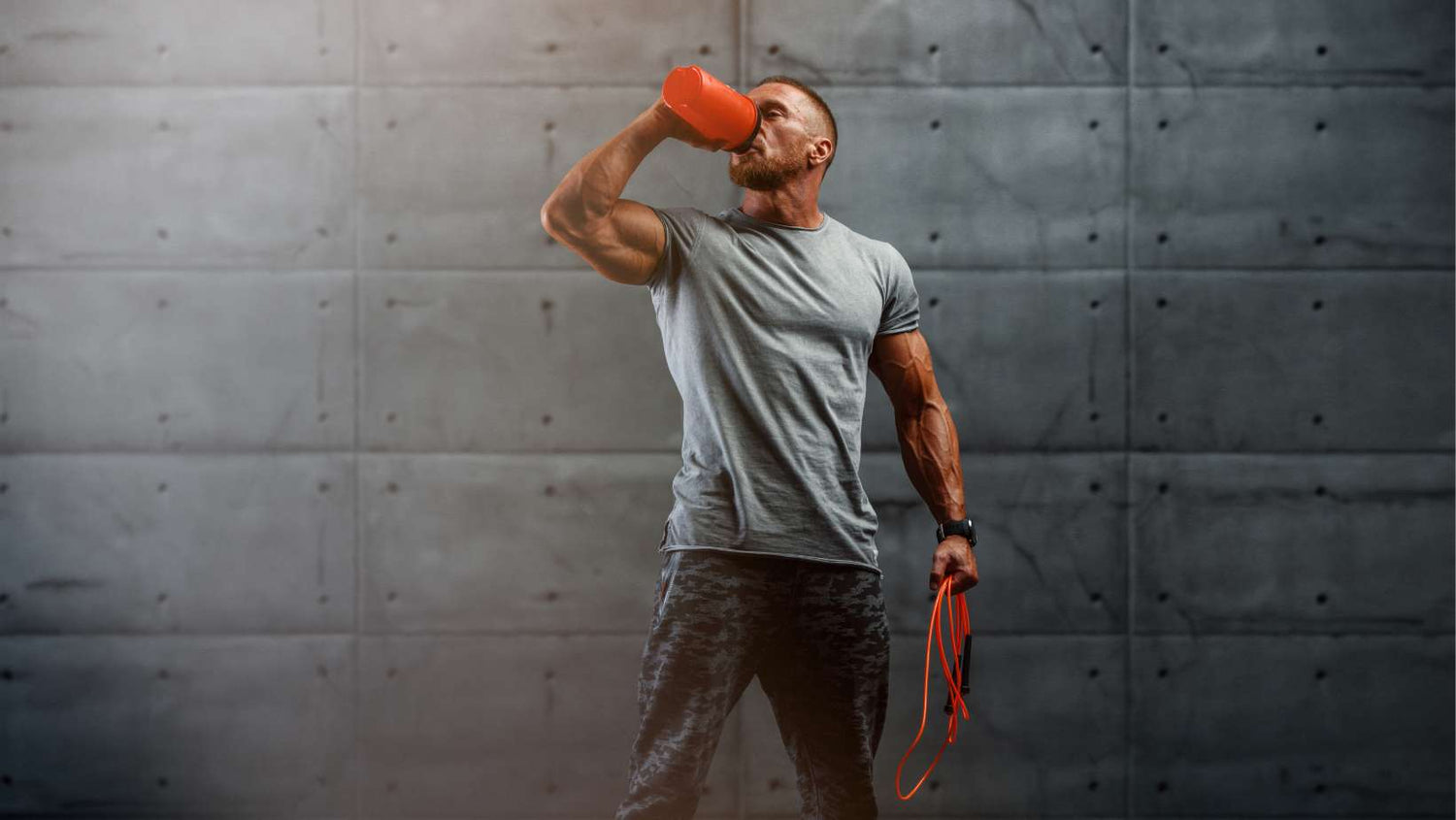 Nutritional Supplement. Muscular Men Drinks Protein, Energy Drink After Workout