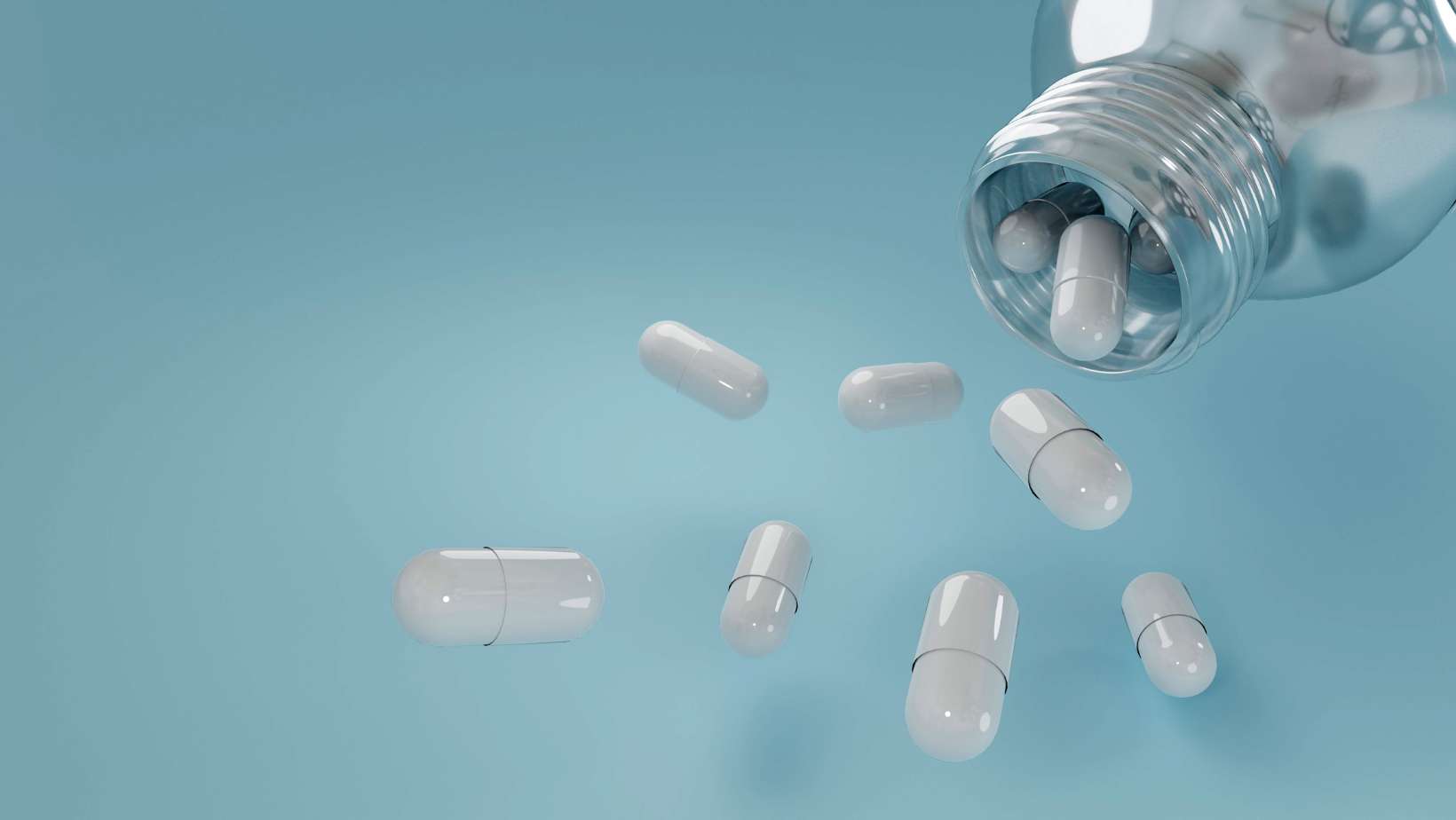Pills falling down from capsule. Night time fat burner safety concept
