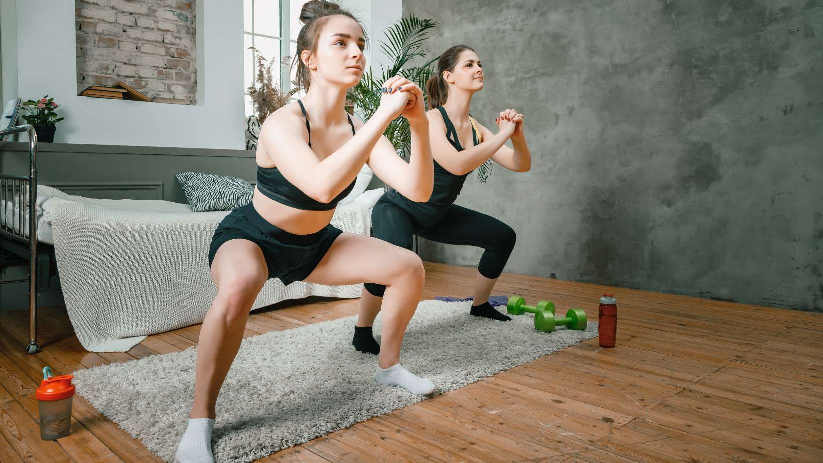 Young women go in for a squat workout at home