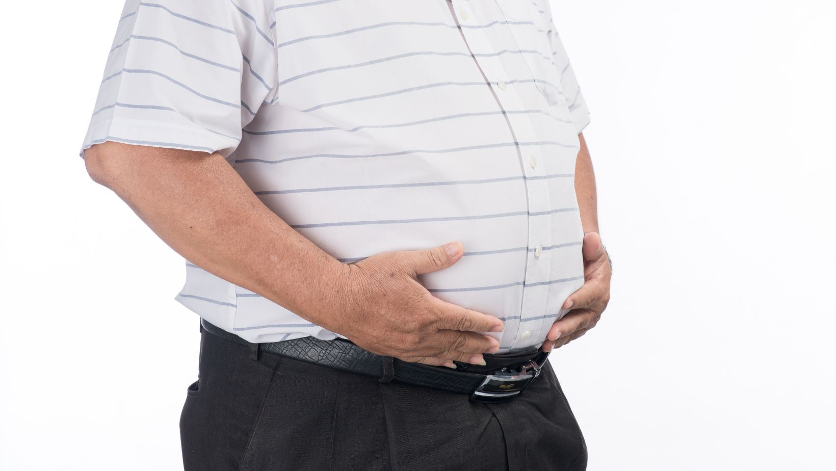 fat man belly. close up shot of fat, obese, overweight dad bod stomach. southeast asian man model