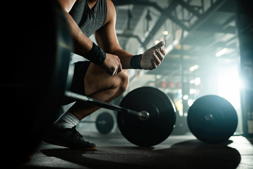 man preparing to do rack pulls