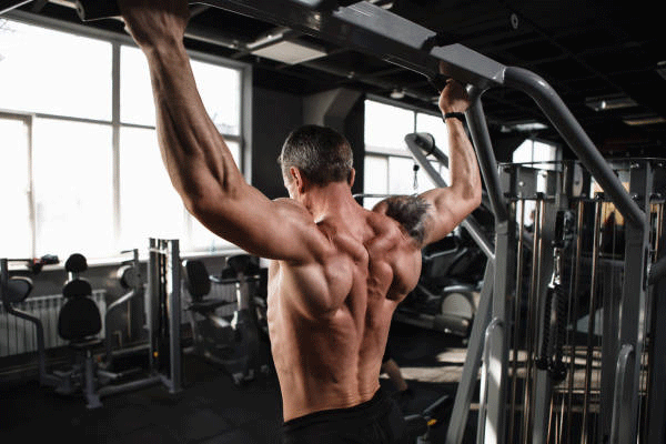 Man doing wide grip pull up