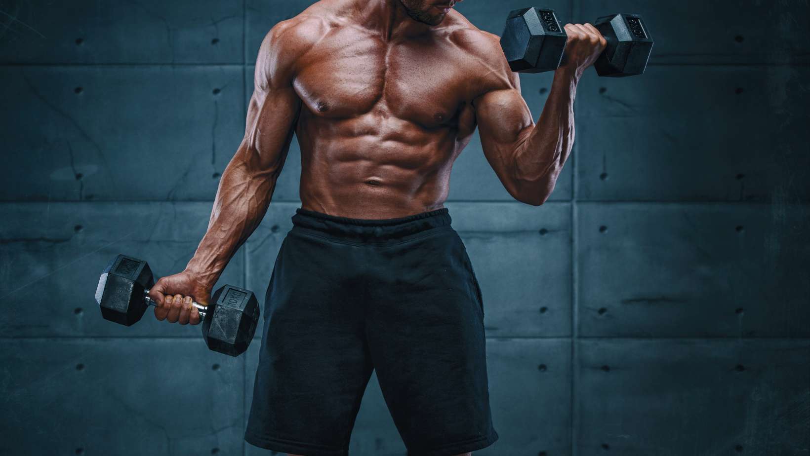 muscular man performing dumbbell curls